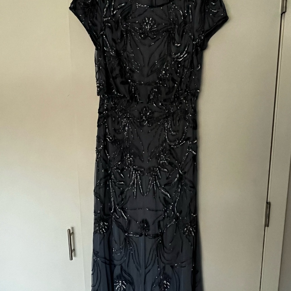 Adriana Pappel evening wear dress from 2022 with short sleeves and sequins.